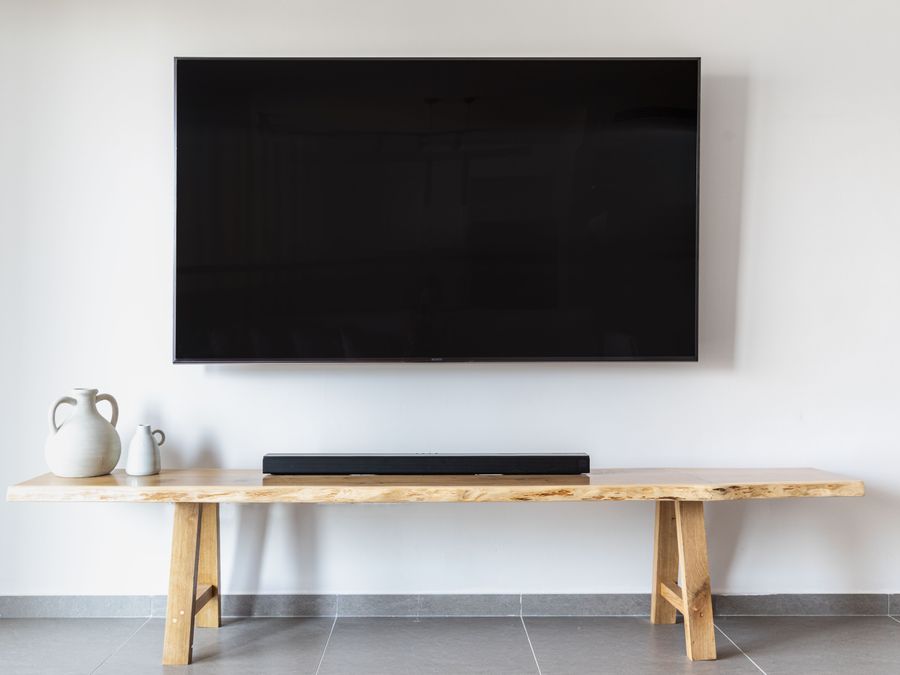 Wall-mounted flat-screen TV entertainment setup by Nawlinz Handyman